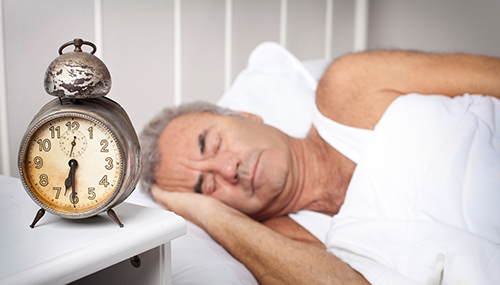 Older Man Suffering from Sleep Apnea
